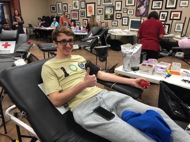 A student saves lives by giving blood