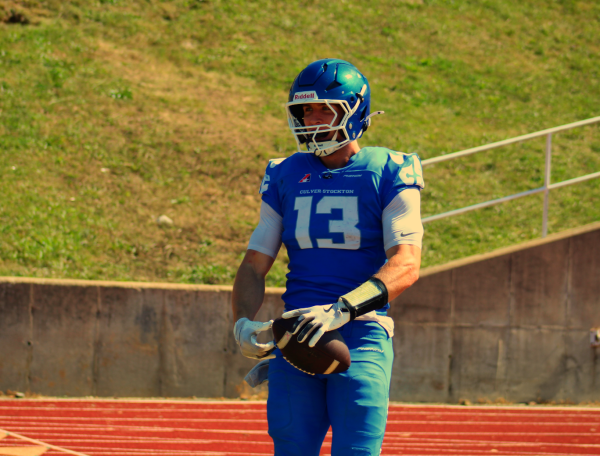 Kyle Dixon celebrating after scoring a touchdown against William Penn